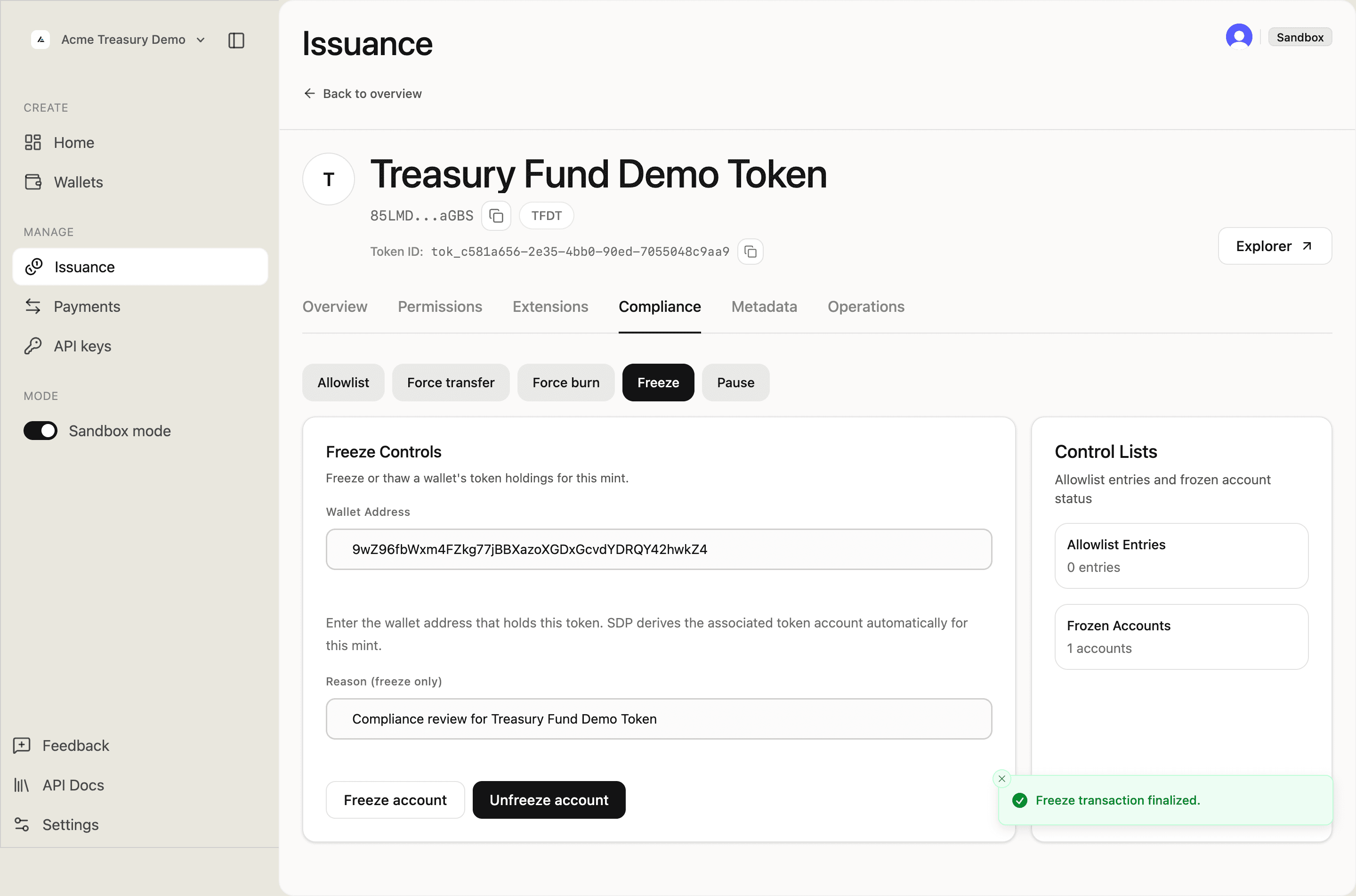 Compliance tab showing Freeze transaction finalized toast and Frozen Accounts count updated to 1