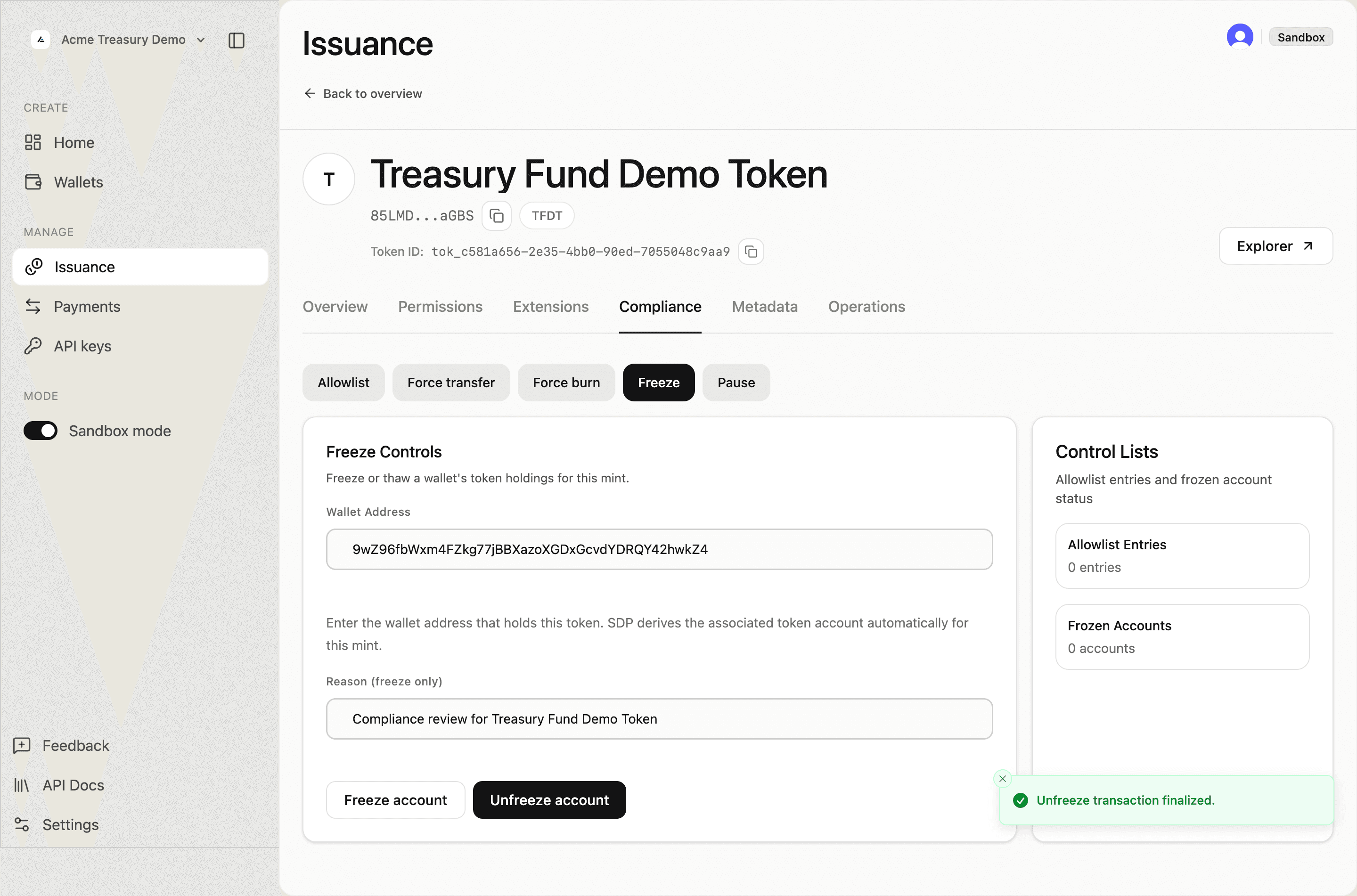Compliance tab showing Unfreeze transaction finalized toast and Frozen Accounts count back to 0